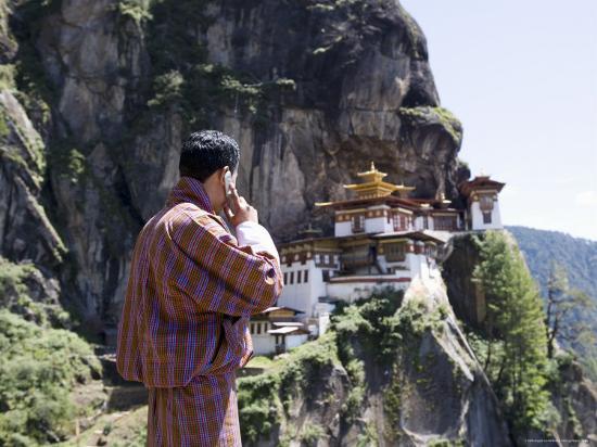 angelo-cavalli-bhutanese-man-with-cell-phone-taktshang-goemba-tiger-s-nest-monastery-paro-bhutan-asia_u-l-p2m41o0